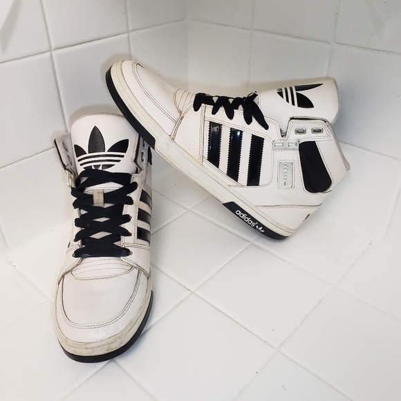 white and black adidas high tops